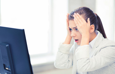 Image showing stressed student with computer in office