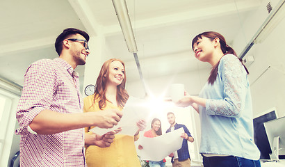 Image showing creative team on coffee break talking at office