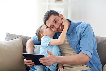 Image showing father and son with tablet pc playing at home