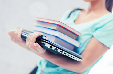 Image showing student with books, computer and folders