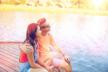 Image showing happy teenage couple hugging on river berth