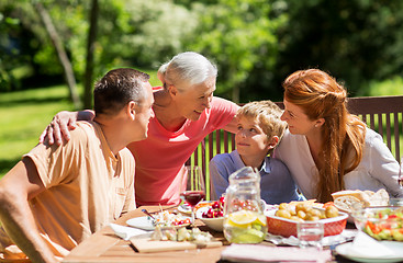 Image showing happy family having dinner or summer garden party