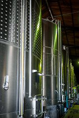 Image showing metal wine barrels in a winery