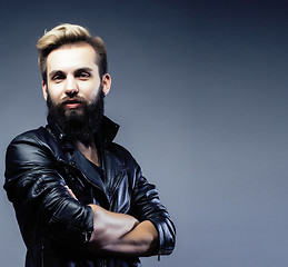 Image showing portrait of young bearded hipster guy on gray dark background close up, brutal modern man, lifestyle people concept