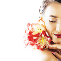 Image showing young pretty brunette woman with red flower amaryllis close up i