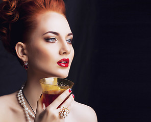 Image showing beauty stylish redhead woman with hairstyle and manicure wearing