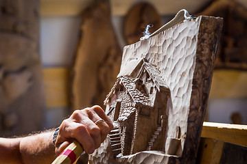 Image showing Sculptor hands working wood