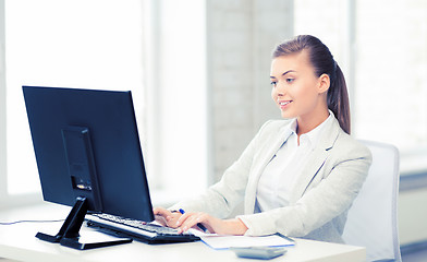 Image showing businesswoman with computer in office