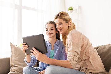 Image showing happy family with tablet pc at home