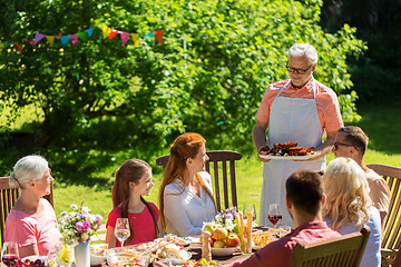 Image showing happy family having dinner or summer garden party