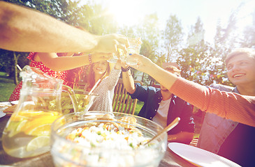 Image showing happy friends with drinks at summer garden party