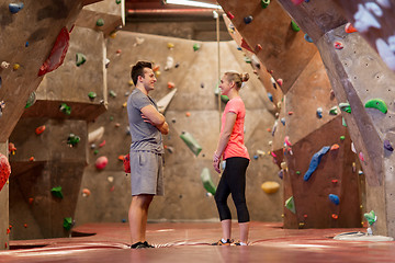 Image showing man and woman talking at indoor climbing gym