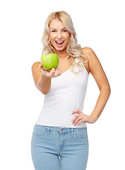 Image showing happy beautiful young woman with green apple