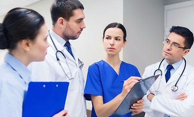 Image showing group of medics with clipboards at hospital