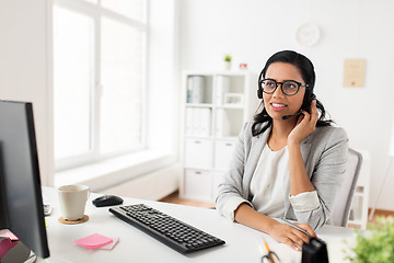 Image showing businesswoman with headset and computer at office