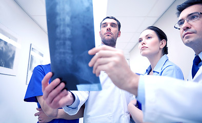 Image showing group of medics with spine x-ray scan at hospital