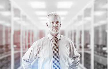 Image showing Senior businessman in server room