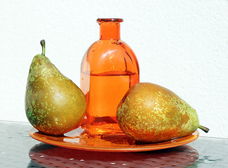 Image showing Two pears and bottle with cider