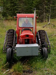 Image showing Man in old abandoned tractor