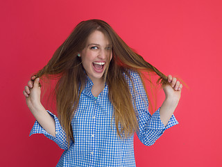 Image showing woman playing with her long silky hair