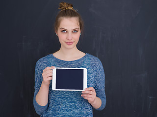 Image showing woman using tablet computer isolated over gray