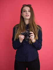 Image showing girl taking photo on a retro camera