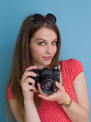 Image showing beautiful girl taking photo on a retro camera