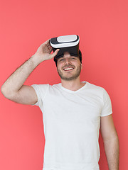 Image showing young man using VR headset glasses of virtual reality