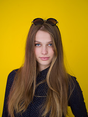 Image showing young woman isolated on yellow background