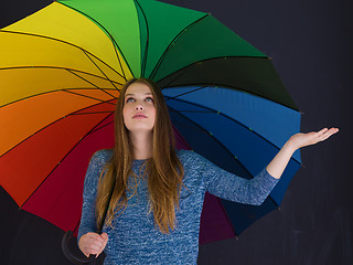 Image showing handsome woman with a colorful umbrella