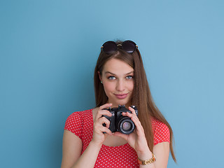 Image showing beautiful girl taking photo on a retro camera