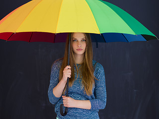 Image showing handsome woman with a colorful umbrella