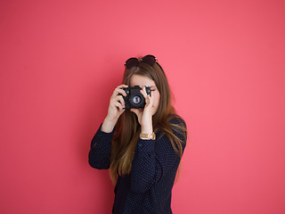 Image showing girl taking photo on a retro camera