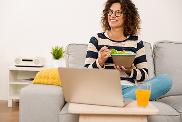 Image showing Beautiful woman eating a salad