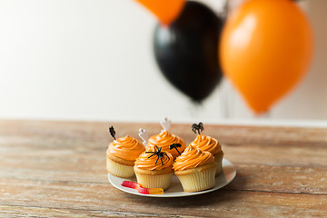 Image showing halloween party decorated cupcakes on plate