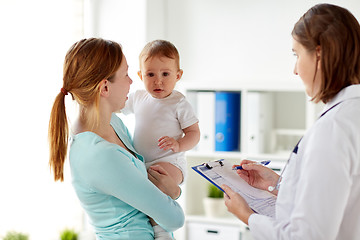 Image showing happy woman with baby and doctor at clinic