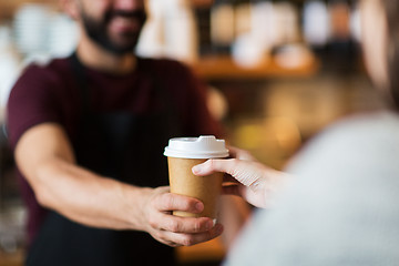 Image showing man or bartender serving customer at coffee shop