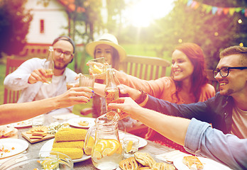 Image showing happy friends with drinks at summer garden party