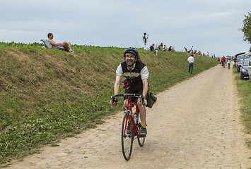 Image showing Amateur Cyclist Riding on a Cobblestone Road - Tour de France 20