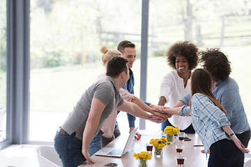 Image showing multiethnic startup Group of young business people celebrating s