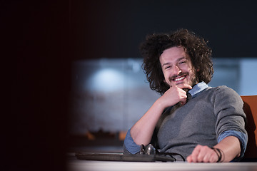 Image showing man working on computer in dark startup office