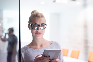 Image showing woman working on digital tablet in night office