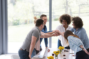 Image showing multiethnic startup Group of young business people celebrating s