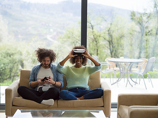 Image showing Multiethnic Couple using virtual reality headset