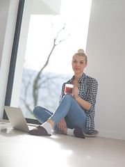 Image showing young woman drinking coffee enjoying relaxing lifestyle