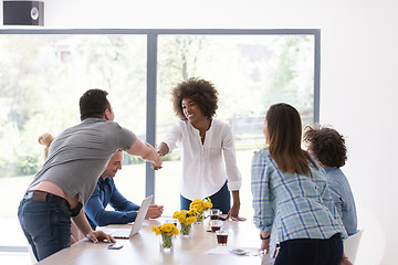 Image showing multiethnic startup Group of young business people celebrating s