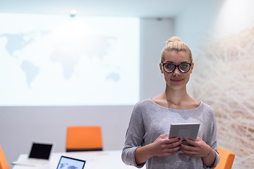 Image showing woman working on digital tablet in night office