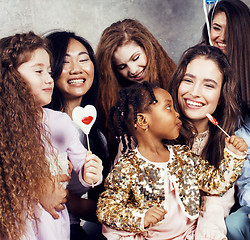 Image showing Lifestyle and people concept: young pretty diversity nations woman with different age children celebrating on birth day party together happy smiling, making selfie. African-american, asian and caucasi