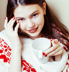 Image showing young pretty brunette girl in Christmas ornament blanket getting warm on cold winter, freshness beauty concept 