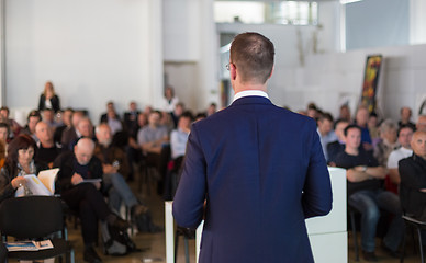 Image showing Public speaker giving talk at Business Event.